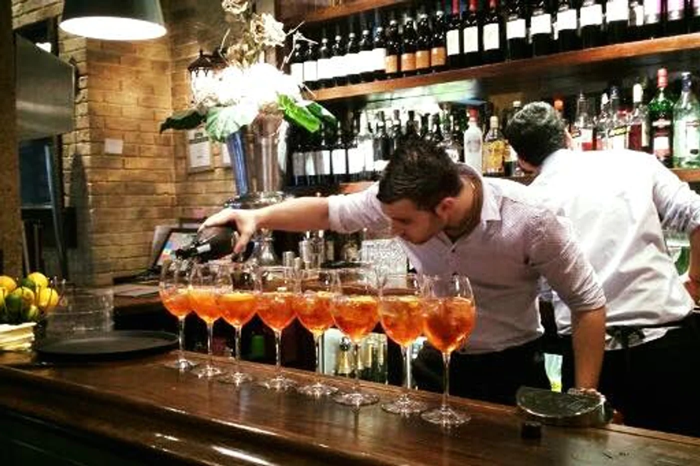 Drinks being prepared behind the bar at Osso Buco, Weybridge